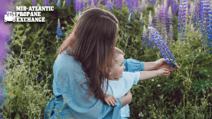 mother and daughter surrounded by flowers