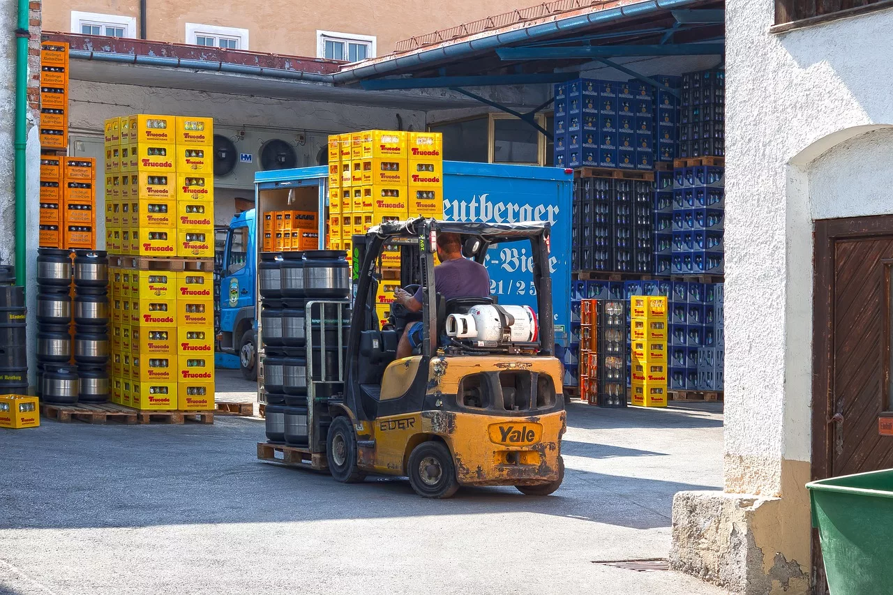 Image of a forklift hauling palettes