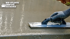 trowel being used on a concrete slab