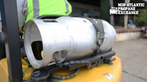 forklift being fueled by a propane tank